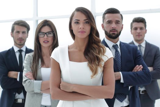 young business woman in front of the business team. the concept of teamwork
