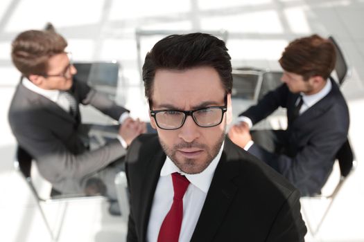 confident businessman on the background of the office.business concept