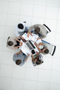 top view.business team discussing financial documents.photo with copy space