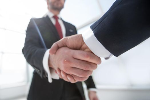 business background.confident handshake of business people.the concept of cooperation