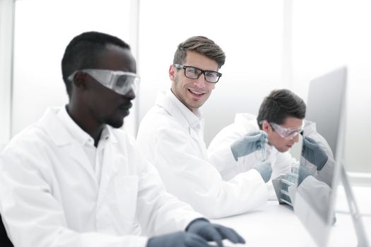 promising scientist working on a computer in the laboratory.science and technology