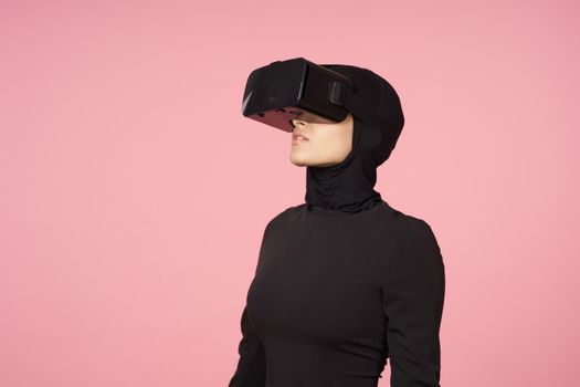 woman in black hijab glasses virtual reality technology movie watching. High quality photo
