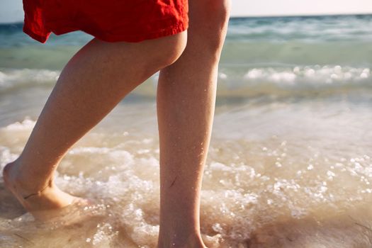 female feet ocean shore sand summer travel. High quality photo