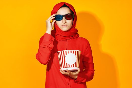 woman in red hijab virtual reality movie fashion fun movie isolated background. High quality photo