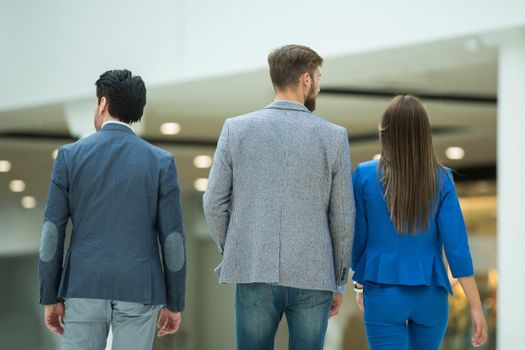 rear view.a group of business colleagues in a modern office.business concept