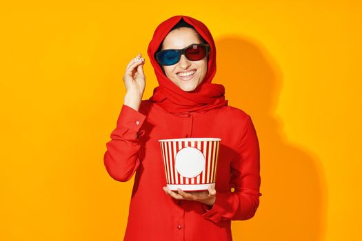 woman in red hijab virtual reality movie fashion fun movie isolated background. High quality photo