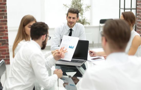 business team holds a meeting in a bright office.the concept of teamwork