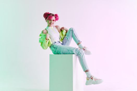 glamorous fashionable woman with pink hair posing hipster neon. High quality photo