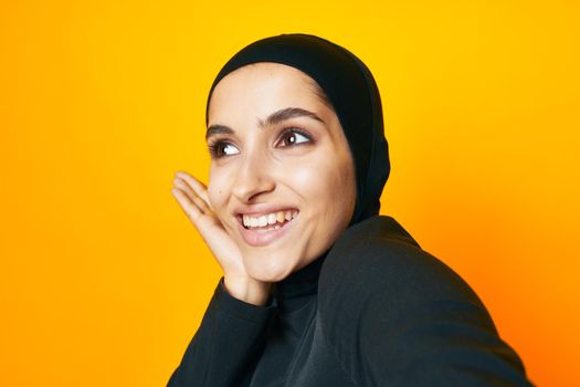 arab woman fun ethnicity model posing emotions yellow background. High quality photo