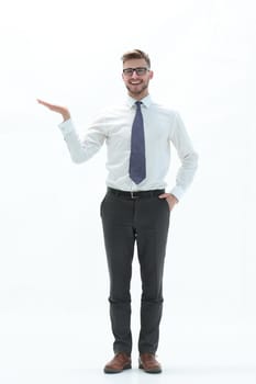in full growth. successful businessman showing a hand with a blank space.photo with text space