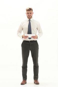 in full growth. modern businessman with a digital tablet.isolated on white background