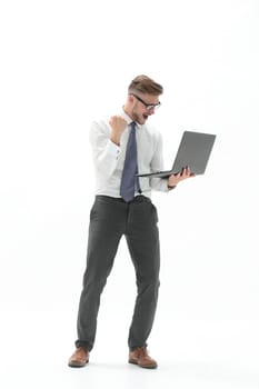 in full growth. happy businessman holding open laptop.photo with copy space