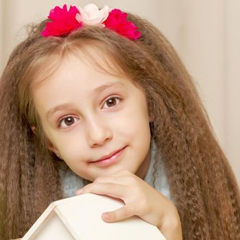 Beautiful little girl close-up. The concept of beauty and fashion, happy childhood. Isolated on white background.