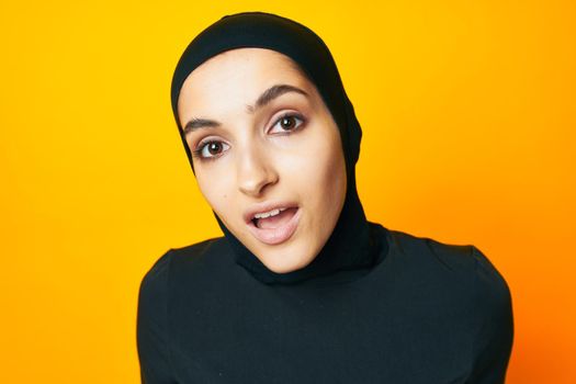 arab woman in black hijab posing fashion hand gesture studio lifestyle. High quality photo