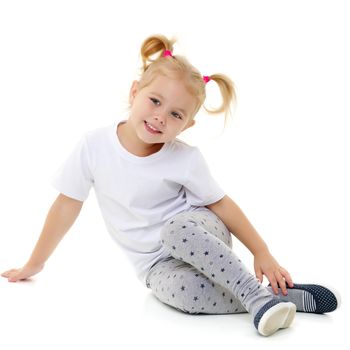 Cute little girl in a pure white T-shirt. On the surface of the shirt is possible inscription or drawing. The concept of advertising children's products. Isolated on white background.