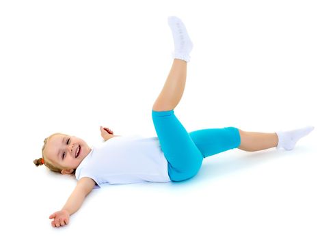 A sweet little gymnast girl performs an acrobatic element on the floor. The concept of sport, healthy lifestyle. Isolated on white background.