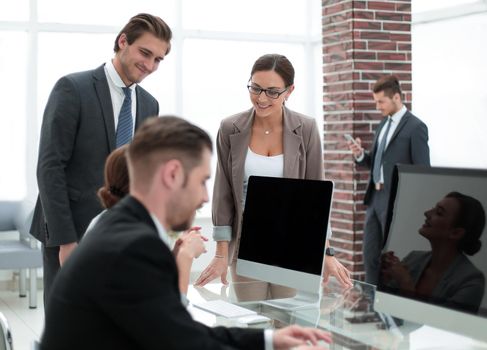 Bank employees sitting at the Desk.people and technology