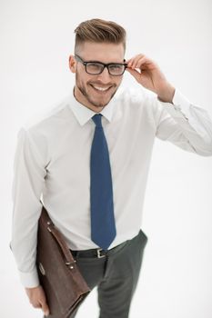 close up.smiling businessman with leather briefcase.isolated on white