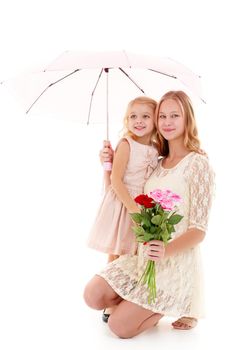 Lovely little girls hid under the umbrella. The concept of a happy childhood, family vacation. Isolated on white background.