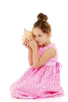 A little girl with a sea shell. The concept of a family vacation at sea, ecology. Isolated on white background.