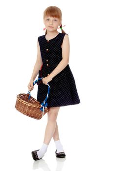 A little girl with a wicker basket made of willow twigs. The concept of family rest, harvesting, picking mushrooms and berries. Isolated over white background