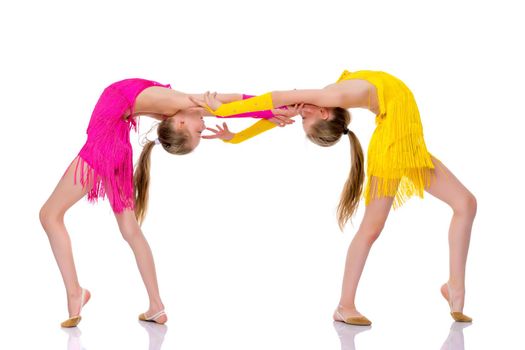 Girls gymnasts perform exercises. The concept of strength, health and sport. Isolated on white background.