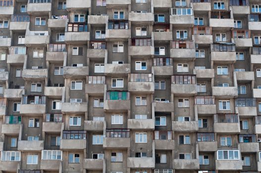 ugly hive like resident block building with lots of windows and balconies