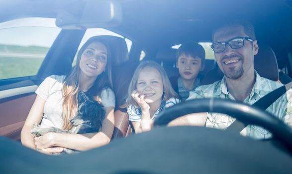 happy family travelling by car.the concept of freedom and travel