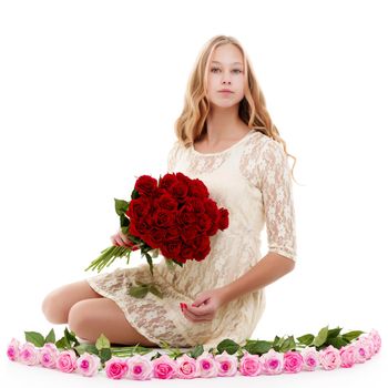 Beautiful young teen girl with a bouquet of flowers. The concept of style and fashion.Isolated on white background.