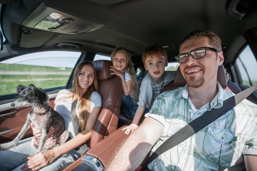 friendly family travels in a comfortable car.the concept of freedom and travel
