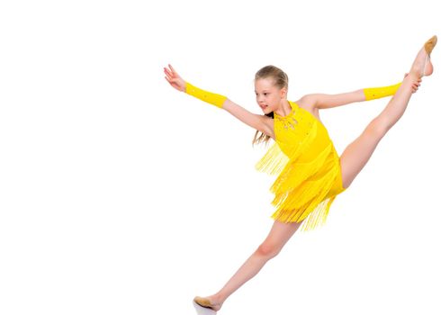 A little girl performs a gymnastic twine. The concept of fitness and sports. Isolated on white background.