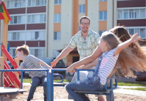 happy family on the Playground.family holiday concept