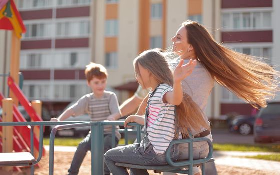 happy family on the Playground.family holiday concept