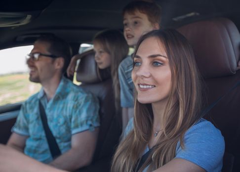 close up. the young woman behind the wheel of the family car.family holiday concept