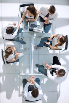 top view.handshake of employees at the working meeting.the concept of teamwork