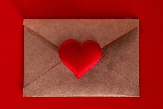 Valentine day love letter of brown paper envelope with red heart