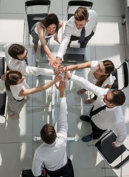 top view.employees of the company showing their unity.the concept of teamwork