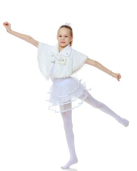 A girl gymnast balances on one leg.The concept of childhood, sport, a healthy lifestyle. Isolated on white background.