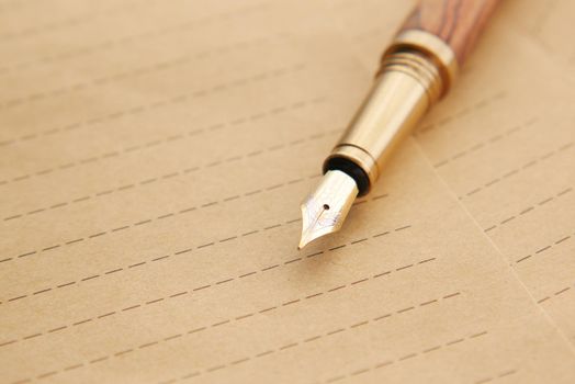 envelope , empty paper and fountain pen on table .