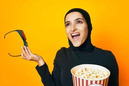 arab woman watching movies 3D glasses fun studio lifestyle. High quality photo
