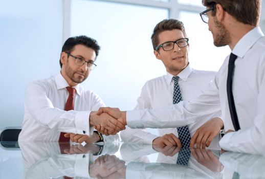 employees greet each other with a handshake.business concept