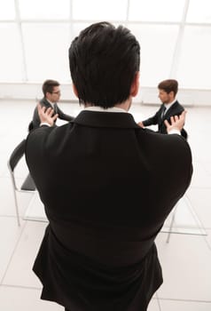 rear view.businessman holds a working meeting.business concept