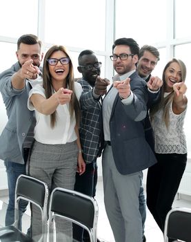 modern business team pointing at you.the concept of choice
