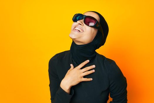cheerful woman watching movies 3D glasses fun yellow background. High quality photo