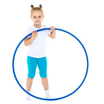 Happy little girl playing with a hoop. The concept of a happy childhood. Isolated on white background.