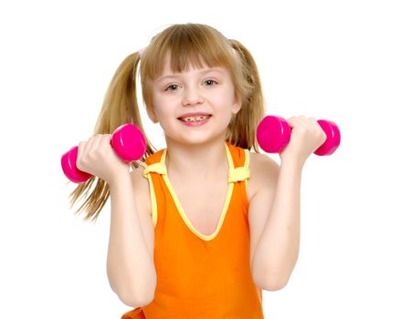 A cute little girl doing exercises with dumbbells. The concept of strength, health and sport. Isolated on white background.