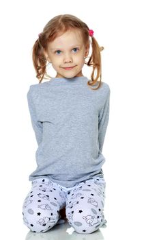 Little girl in pajamas. The concept of family happiness, child, childhood, relaxation. Isolated on white background.