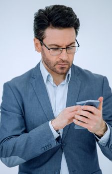 close up. business man reading an SMS on his smartphone.people and technology