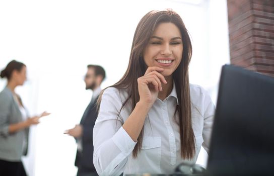 business woman working on laptop in office.photo with text space