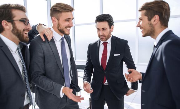 close up.employees talking standing in the office.office weekdays